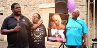 Peiree Booker, father of murdered transgender woman Muhlaysia Booker, speaks at a vigil for his daughter in Dallas in 2019. To his left is Ms. Booker's grandmother Debra Booker. 
