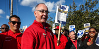 United Auto Workers President Shawn Fain, middle, visits striking UAW Local 551 workers outside a Ford assembly center